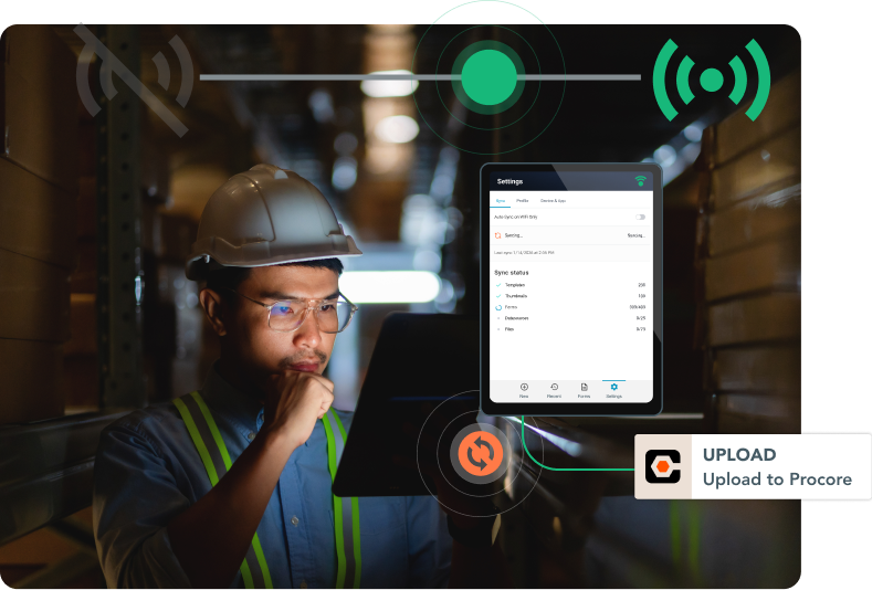 Worker with a tablet showing GoFormz sync status.